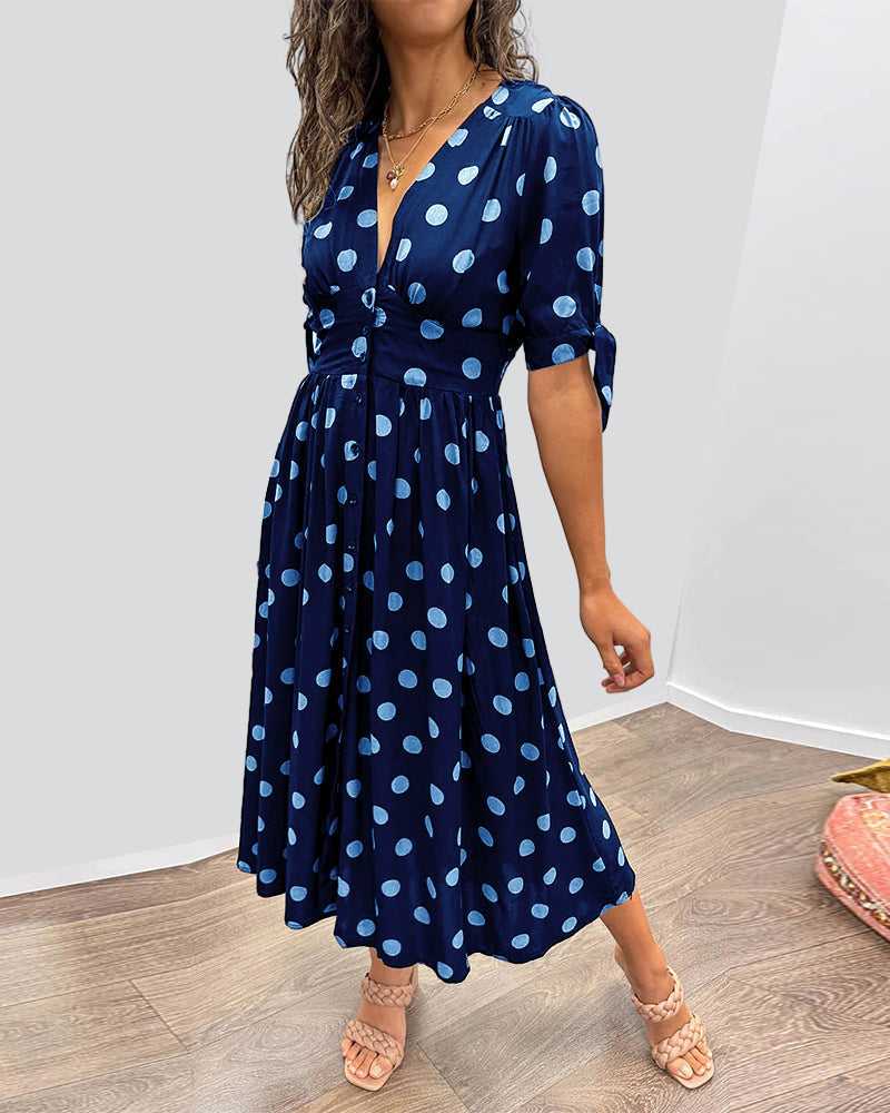 Caterina – Robe midi à pois col V effet sculptant