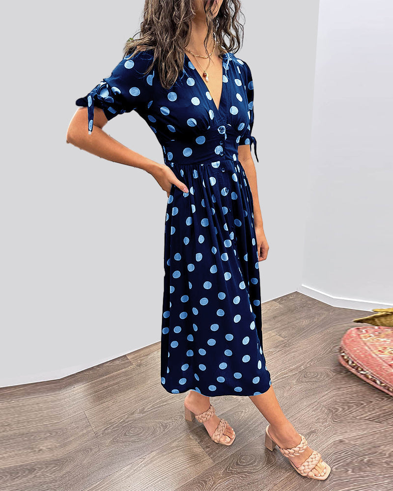 Caterina – Robe midi à pois col V effet sculptant