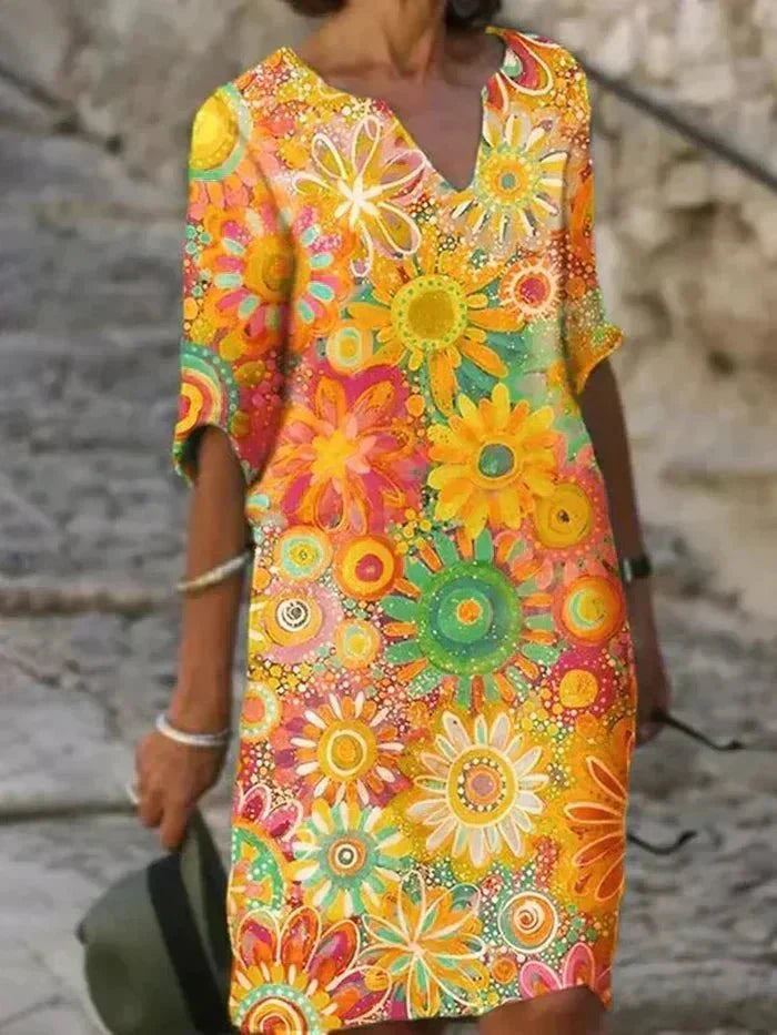 Nira – Robe midi fluide fleurie et élégante