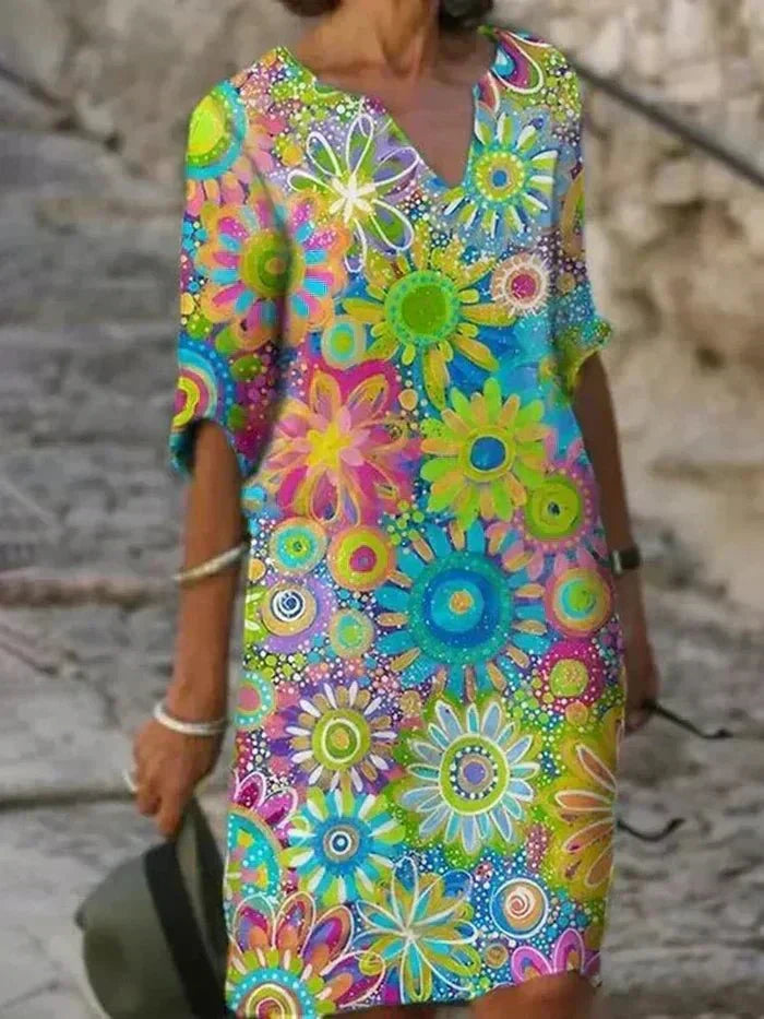 Nira – Robe midi fluide fleurie et élégante